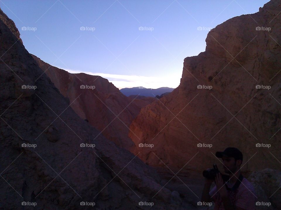 Taking a Picture in Canyon. While hiking in a Death Valley canyon, I took a picture of my friend taking a picture. 