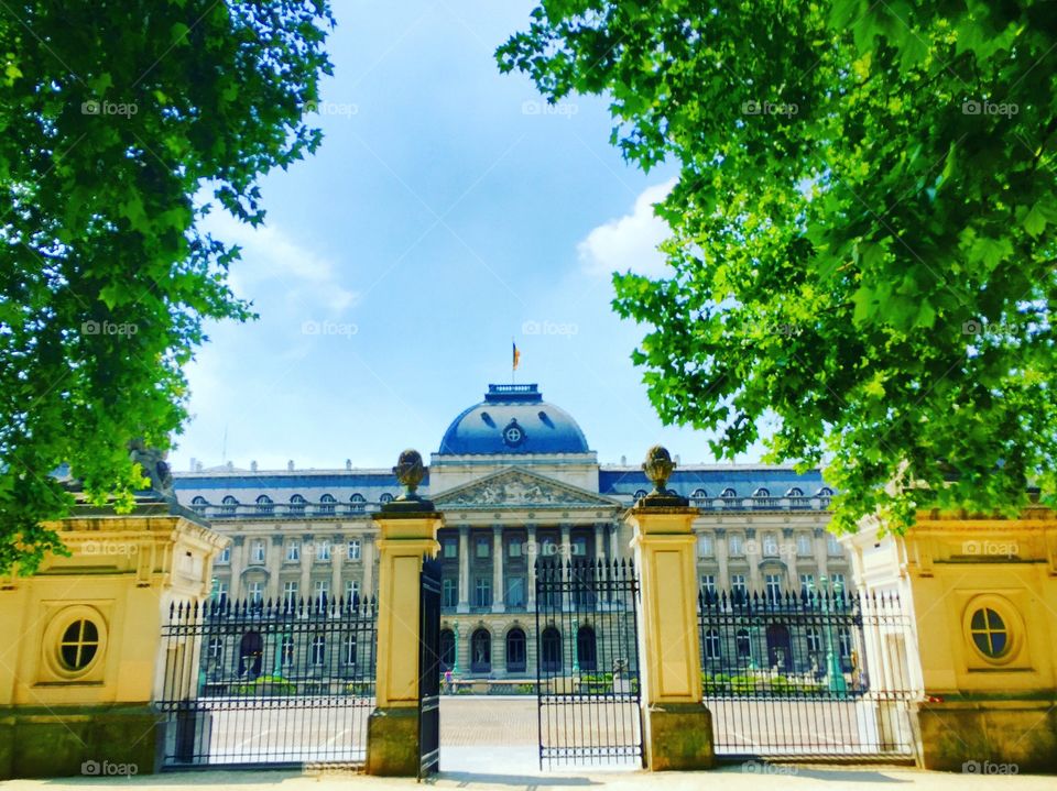 Palace of the Belgian king as seen through the gates of the park on the other side of the street, Brussels, Belgium 