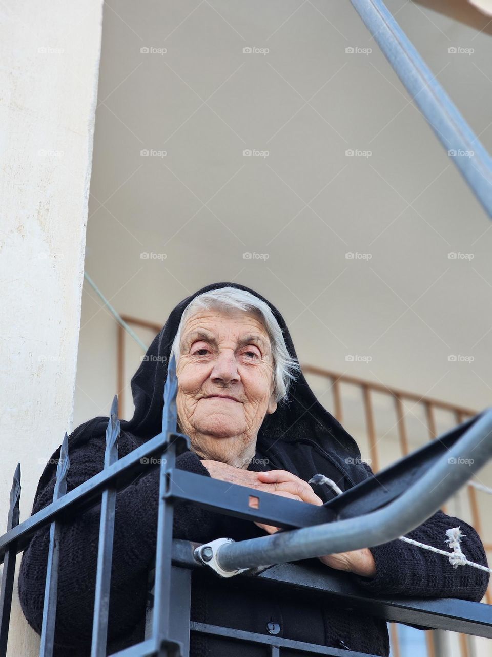 beautiful old woman who shared some kind words with her in a village in Albania