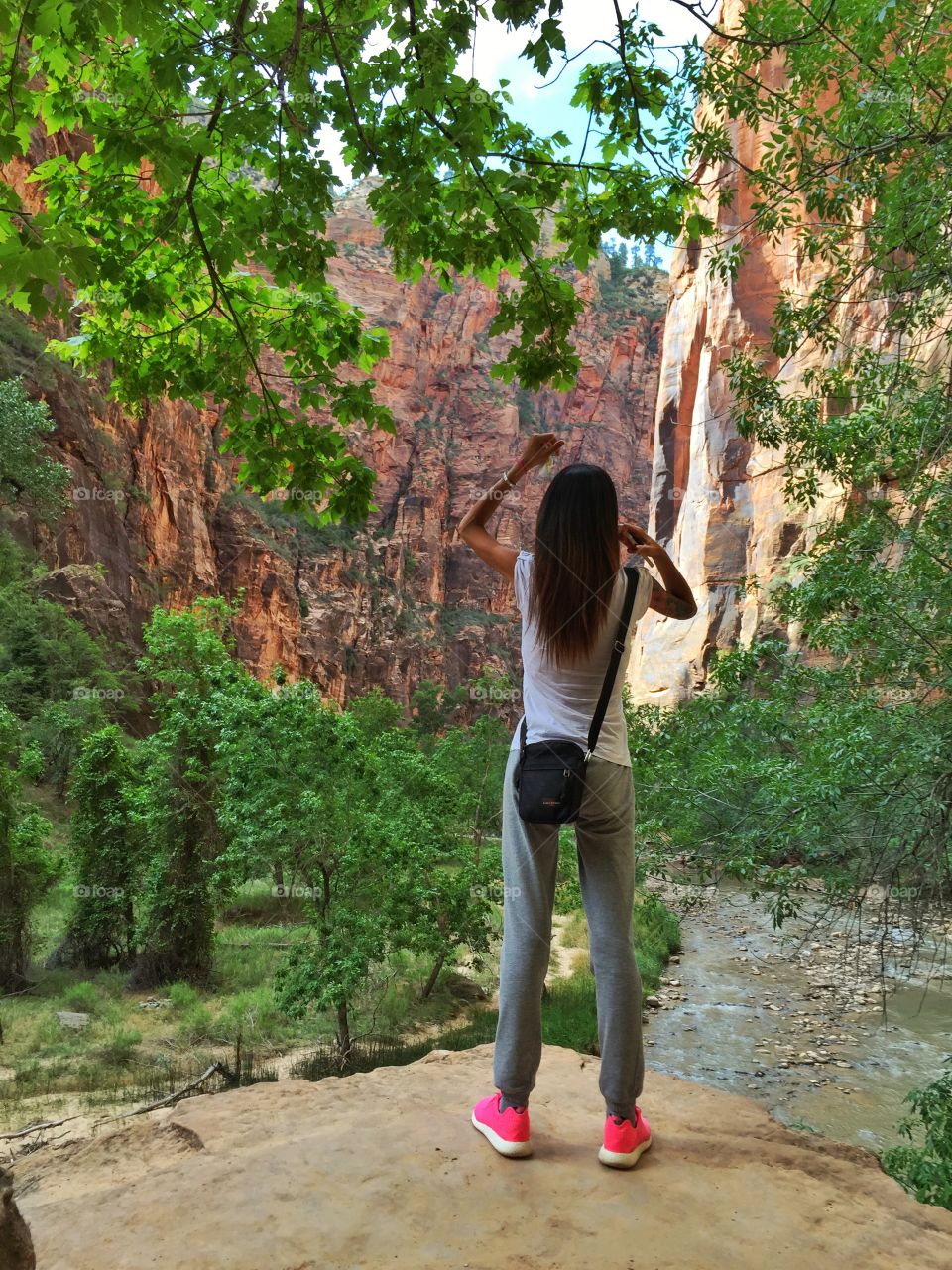 Woman looks the river in the valley at National Zion Park,Utah