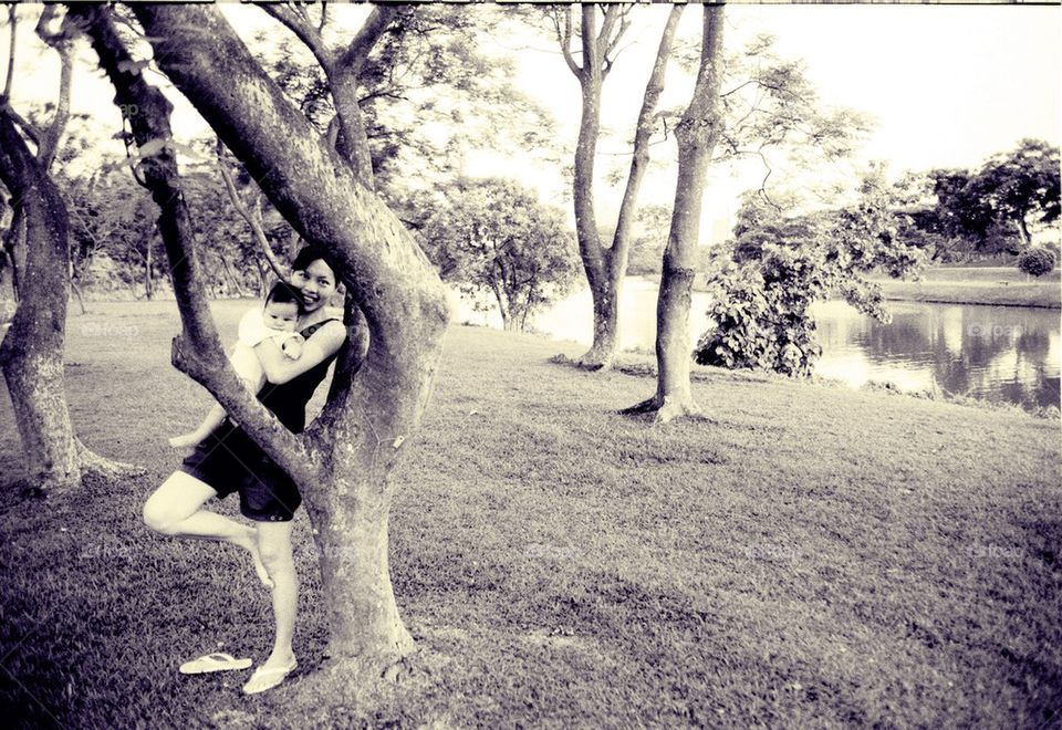 Baby girl and mother inside park