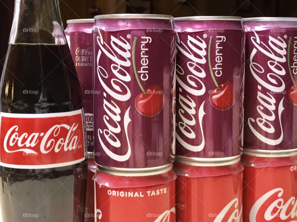 Coca Cola and cherry coke cans and bottle 