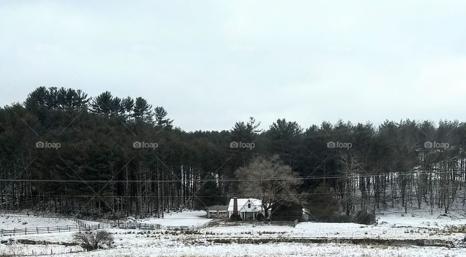 Snowy scene of an abandoned house