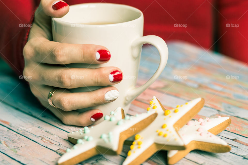 Women hand with cup of tea