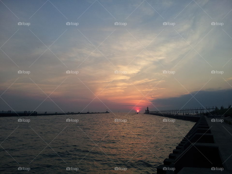 benton harbor sunset. sunset between piers