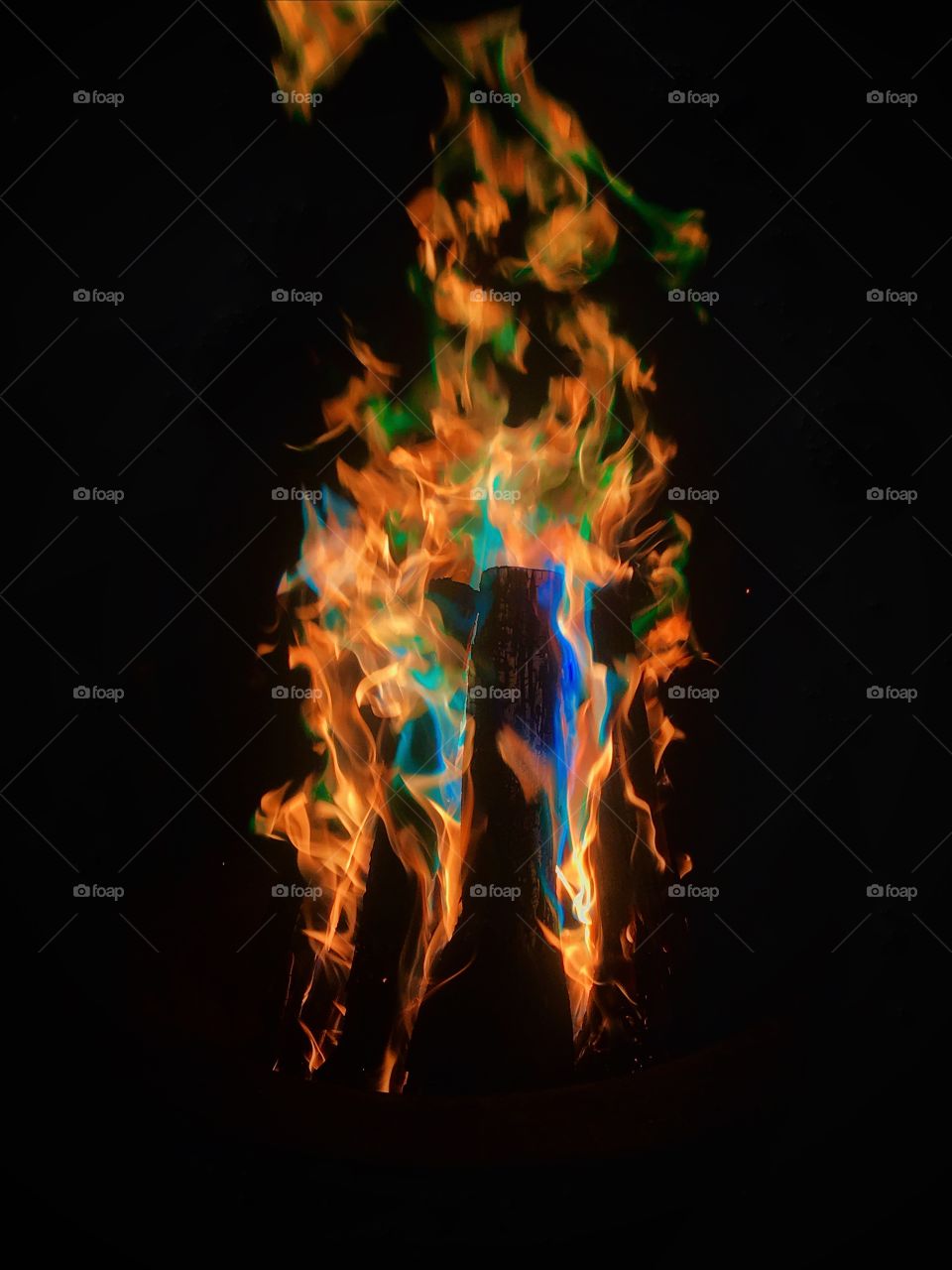 Bonfire with many different colored flames—taken in Ludington, Michigan 