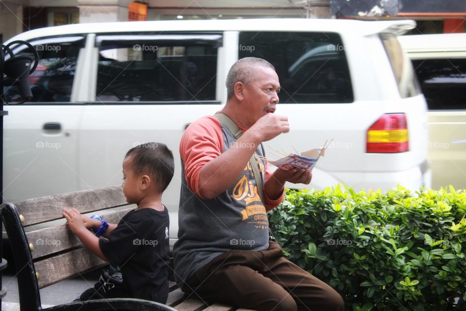 man eat satay at Malioboro Yogyakarta