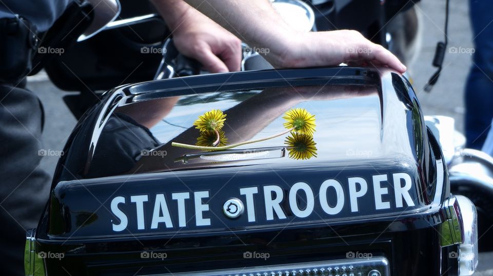 Police motorcycle with flowers on it