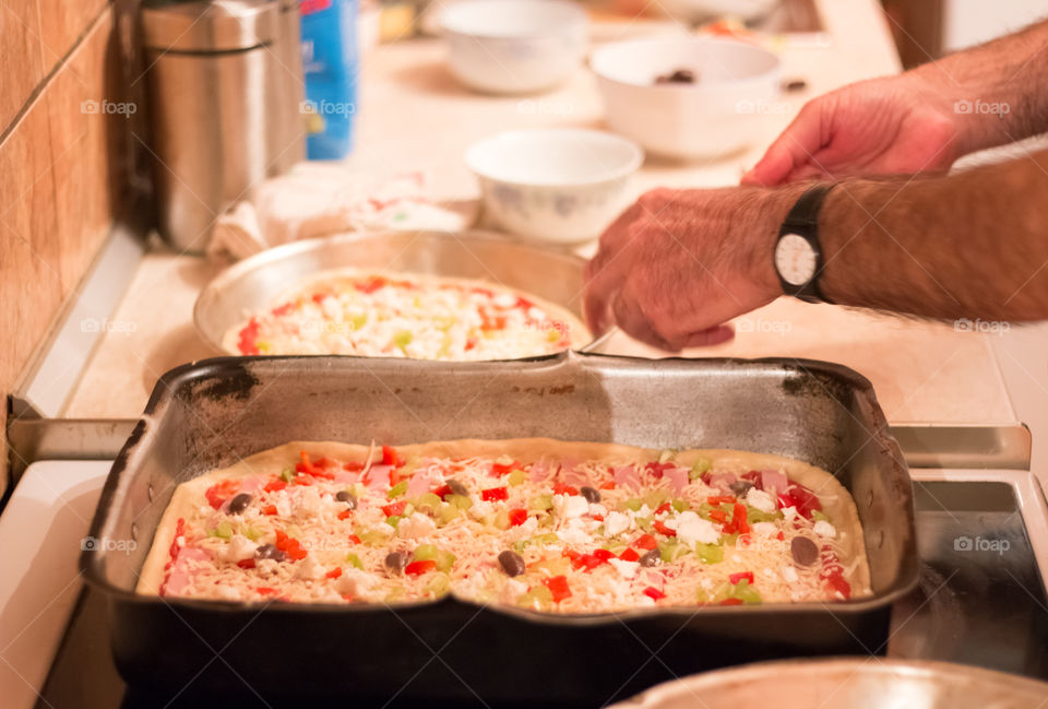 Man Prepares And Cooking Pizza At Home
