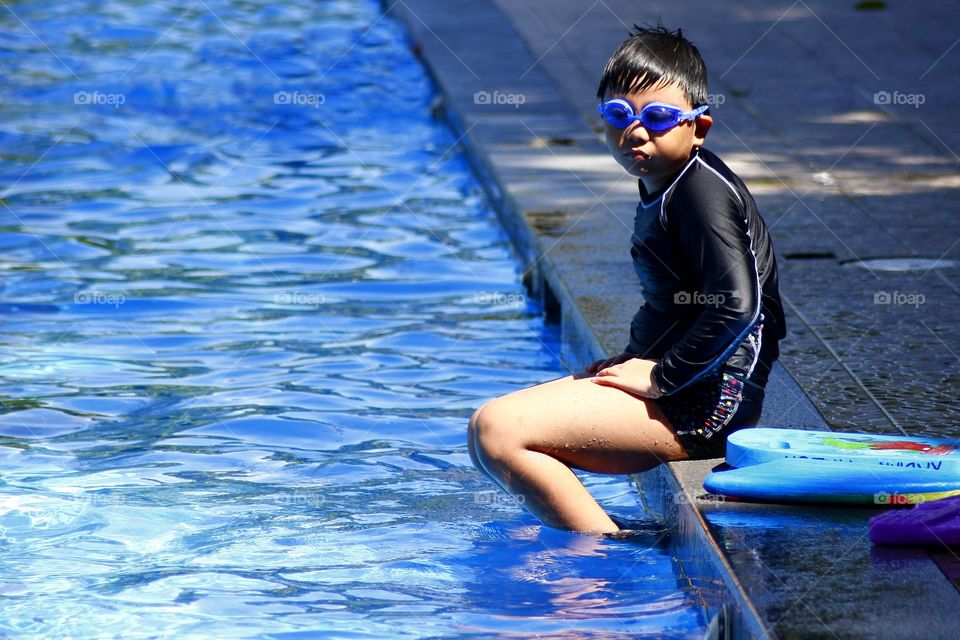 young kid in a swimming pool
