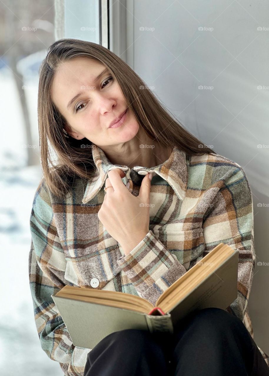 portrait of a woman at the window