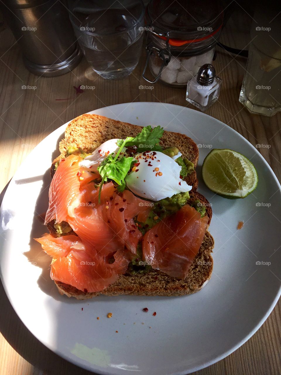 Salmon and poached eggs with avocado on toast  
