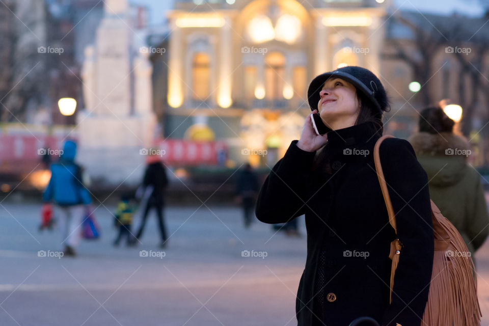 Close-up of a woman with mobile phone