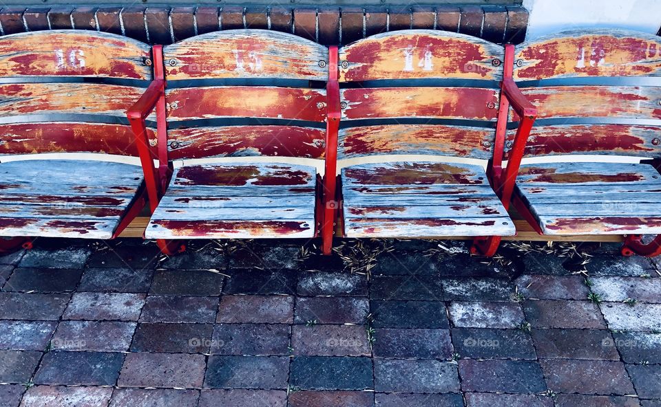 Row of distressed wooden seats
