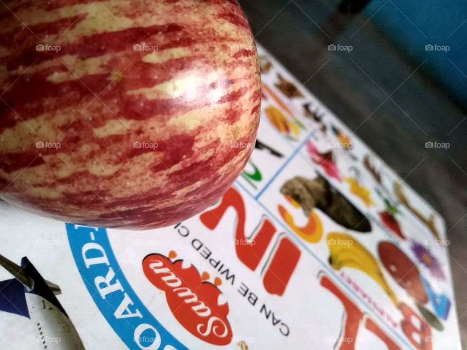 a Apple on book