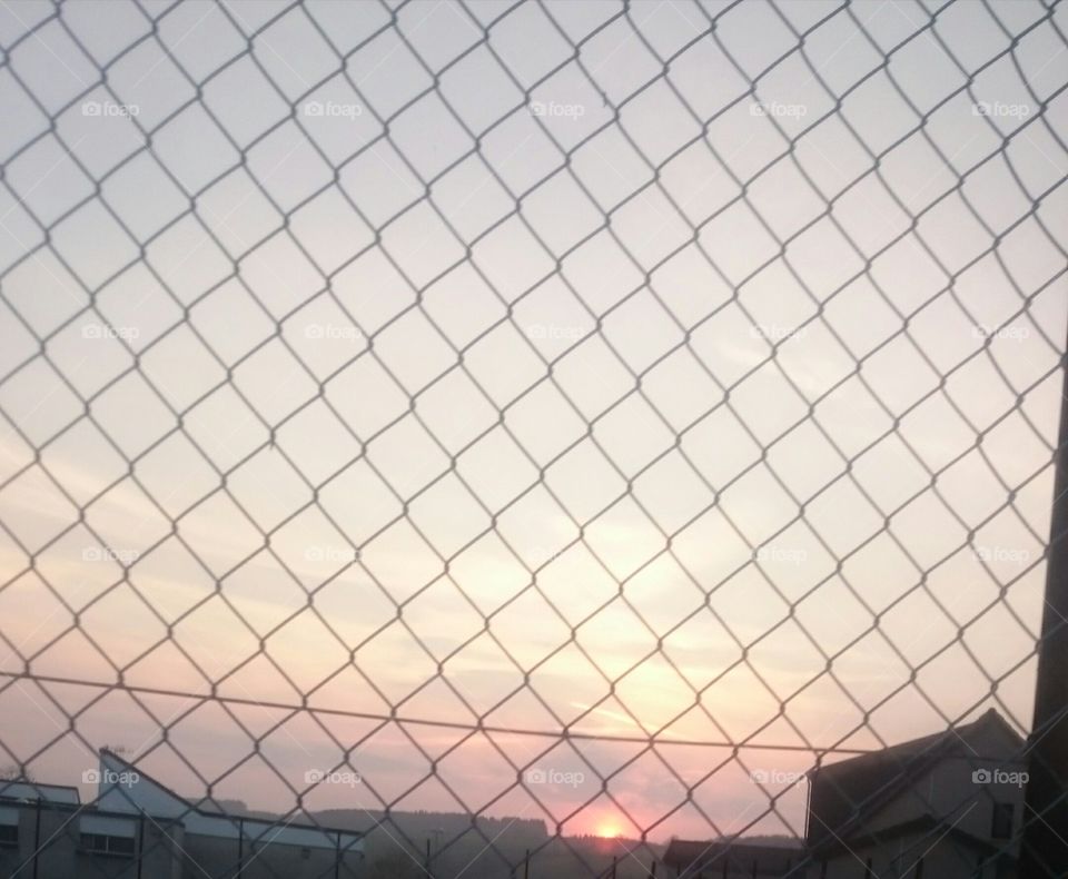 Jedburgh sunset last night through the wire fence at the school
