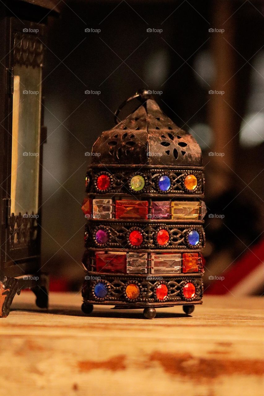 Vintage colourful table lamp made out of wood in close up view