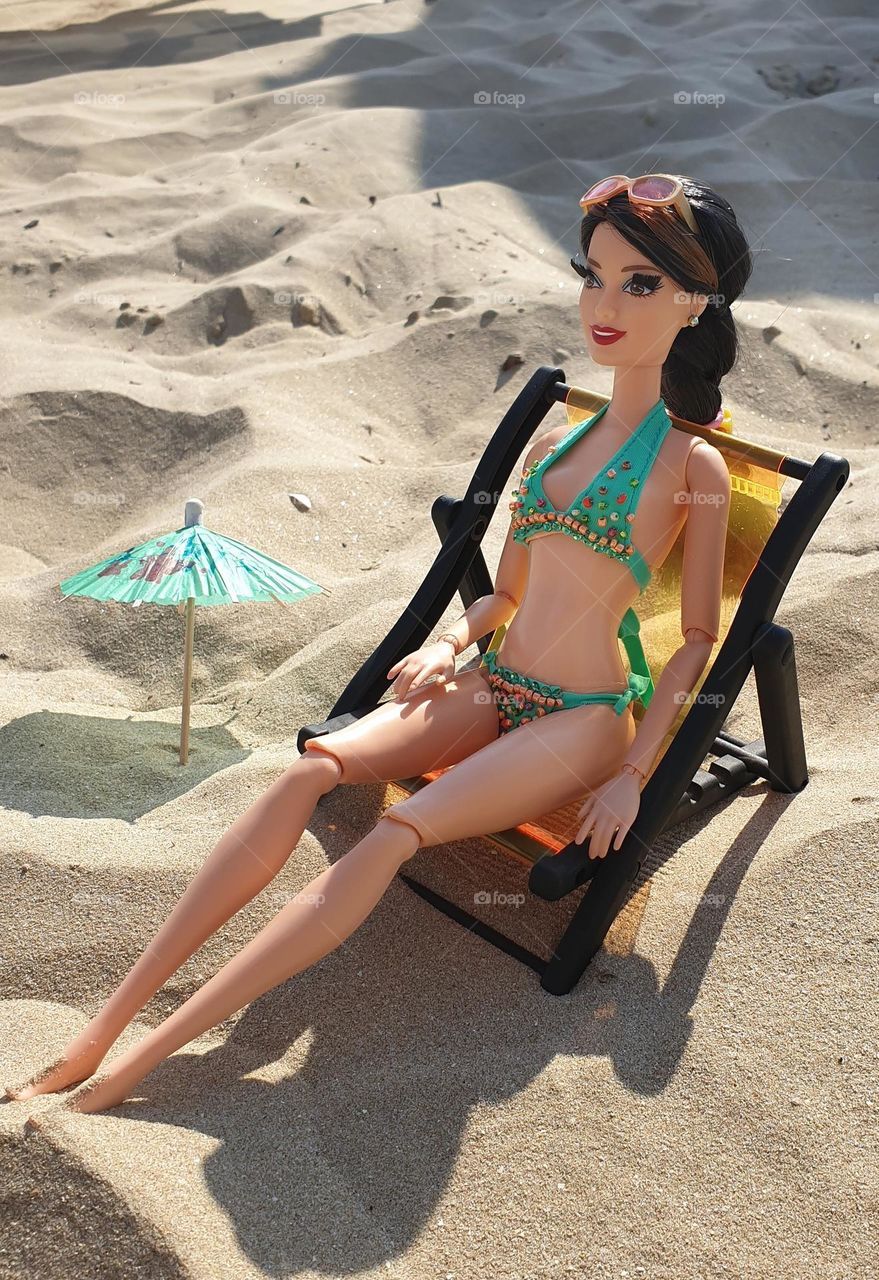 Doll on the beach