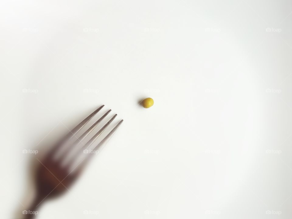 Close-up of fork with fruit