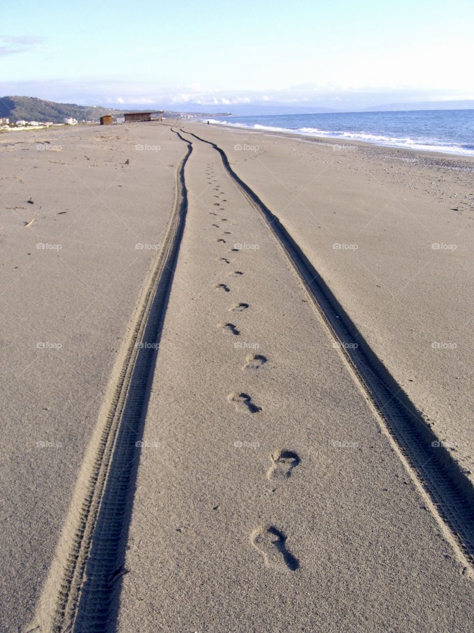 Walking in the beach in a wheels car pathway