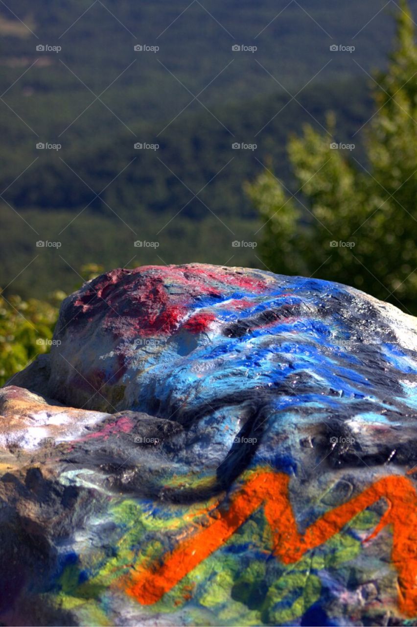 Graffiti covered rock cliffs. 