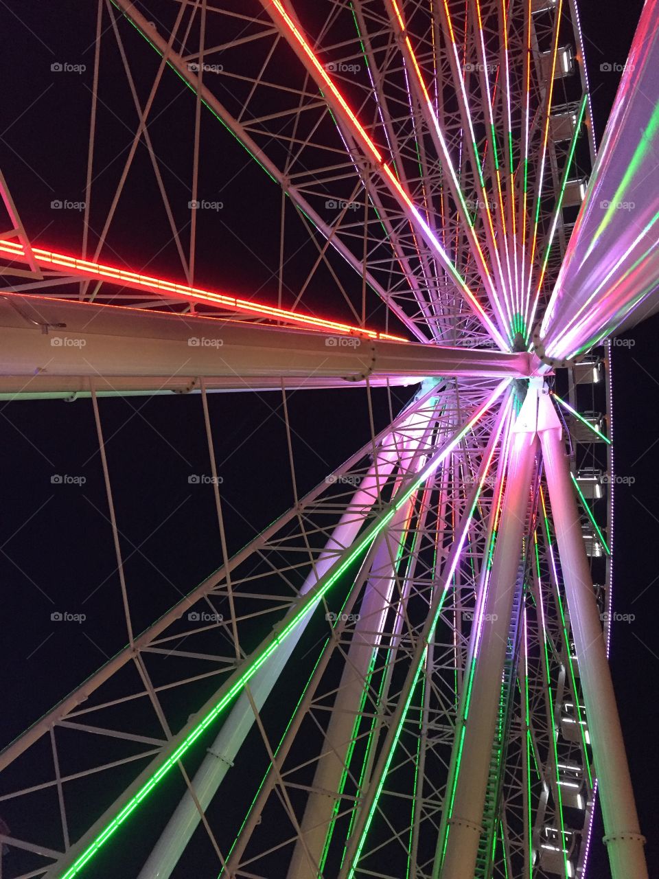 Ferris wheel at night with neon lights