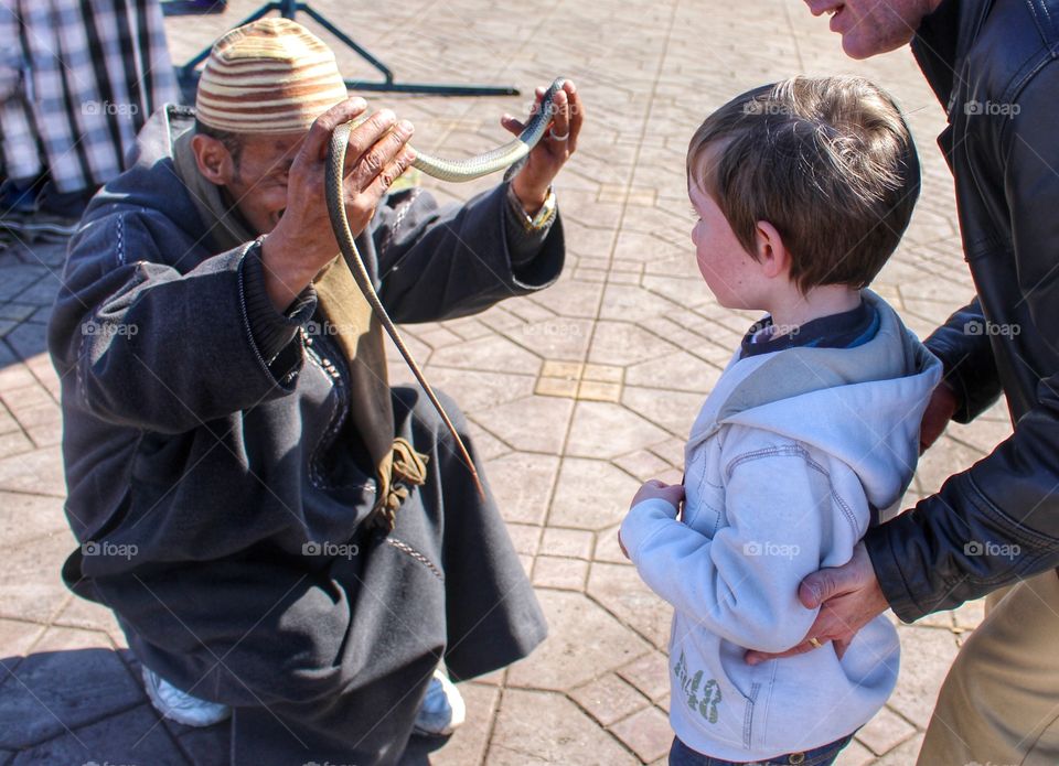 Snake charmer offers my son the chance to get up close and personal with one of his friends!
