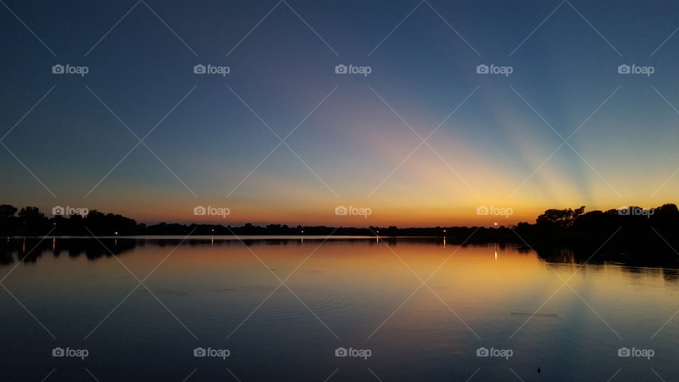 Dramatic sky reflecting on lake