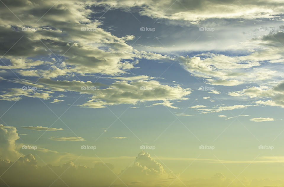 The beauty of the sky with clouds and the sun.