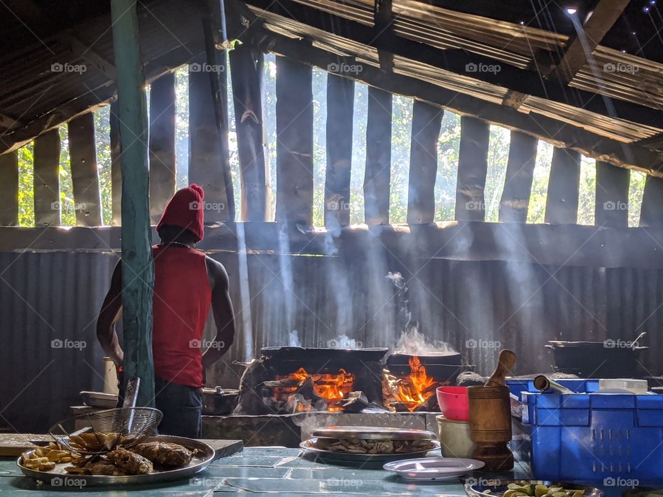 a chef at work in a secret tropical restaurant