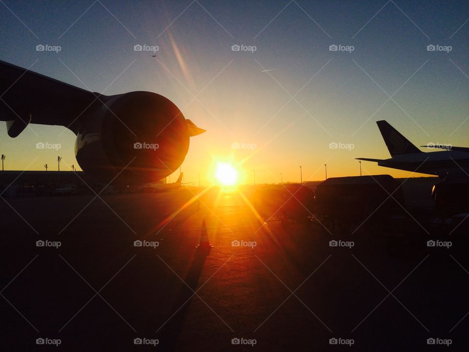 Aero plans at airport during sunset