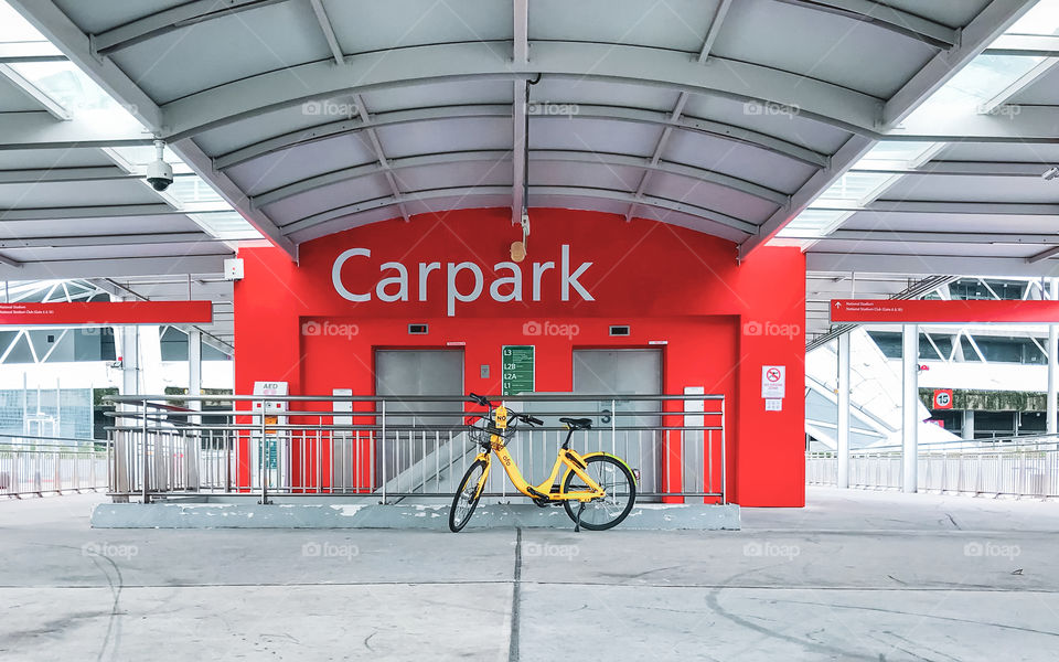 Singapore National Stadium, the elevator to carpark, interesting in red with yellow bike parked near it, love the view so I captured it
