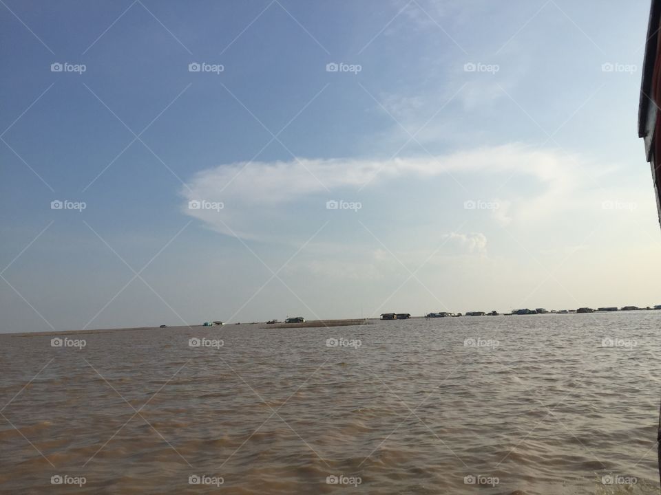 Cambodian Lake, and Floating Village with an Elementary School on the Water