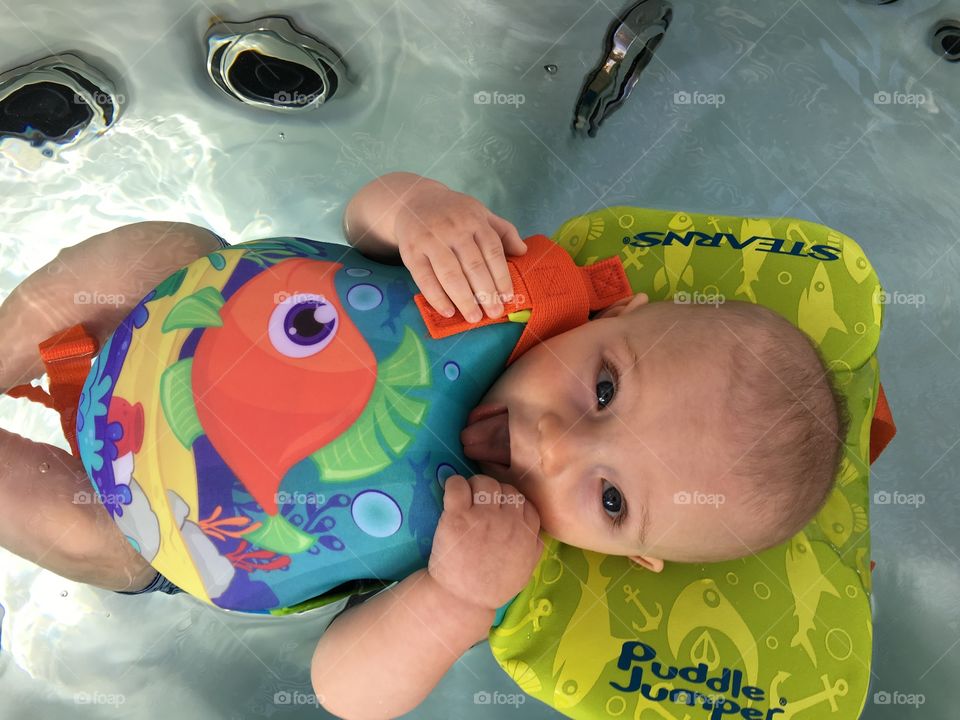 Elevated view of baby lying on water