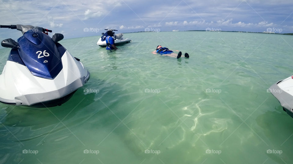 Hopping Off The Jetski for a dip on a Caribbean Sandbar in the Bahamas