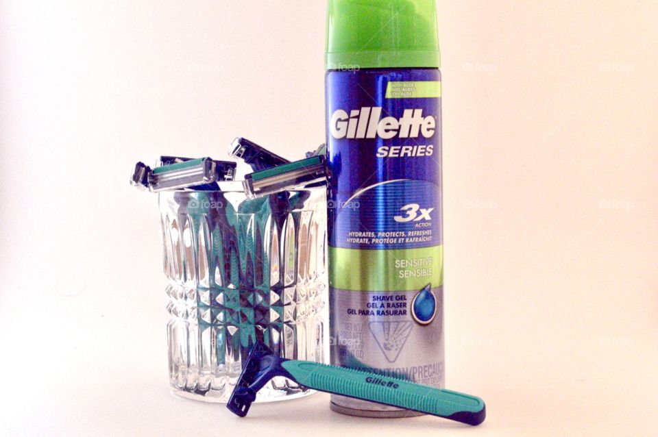Gillette disposable razors and Gillett series 3X shave cream on a marble background 