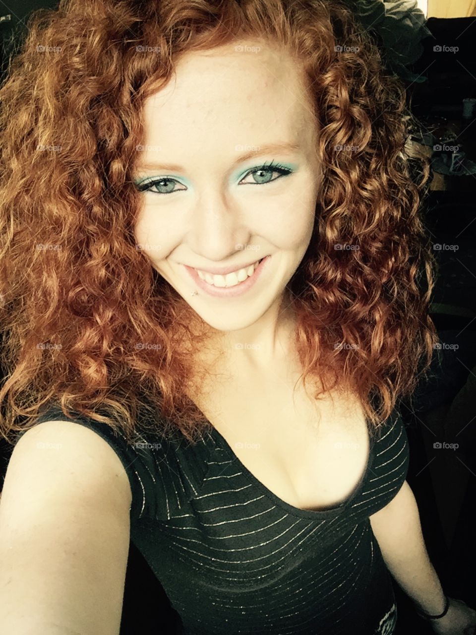 Curly redhead with blue eyes 