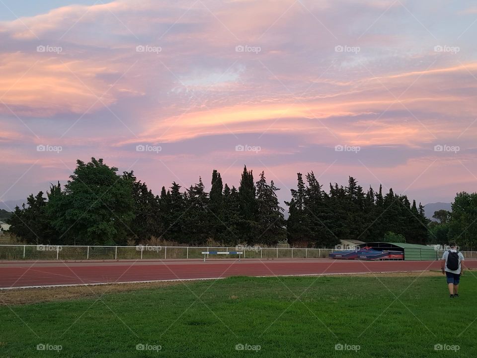 Sunset on the city stadium