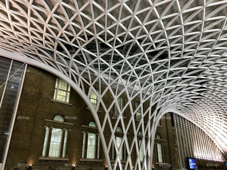 Lines forming a criss cross pattern for the inside roof architecture makeover inside Kings Cross Train Station ... London 🇬🇧