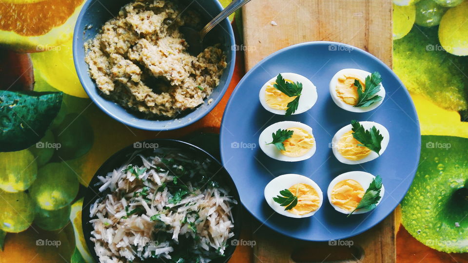 cut boiled eggs decorated with parsley