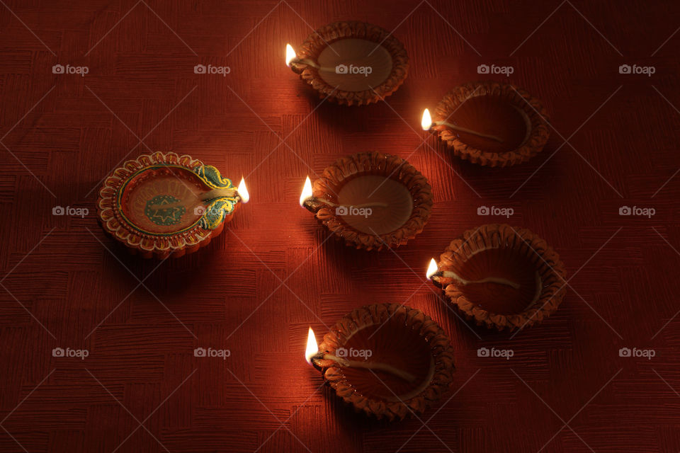 Six burning Diwali traditional lamps