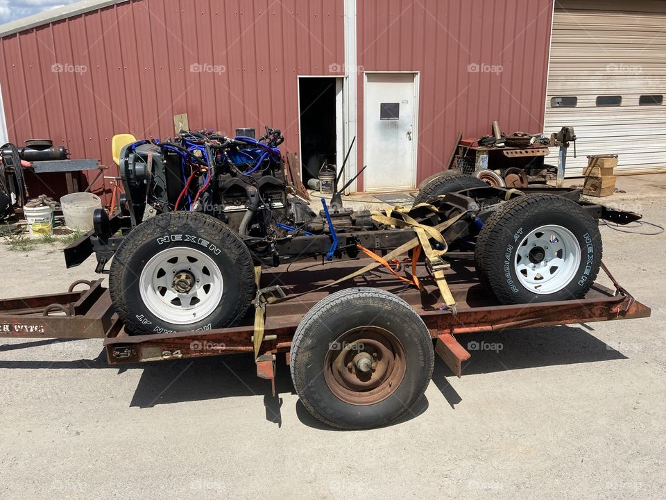 Old jeep chassis on a trailer