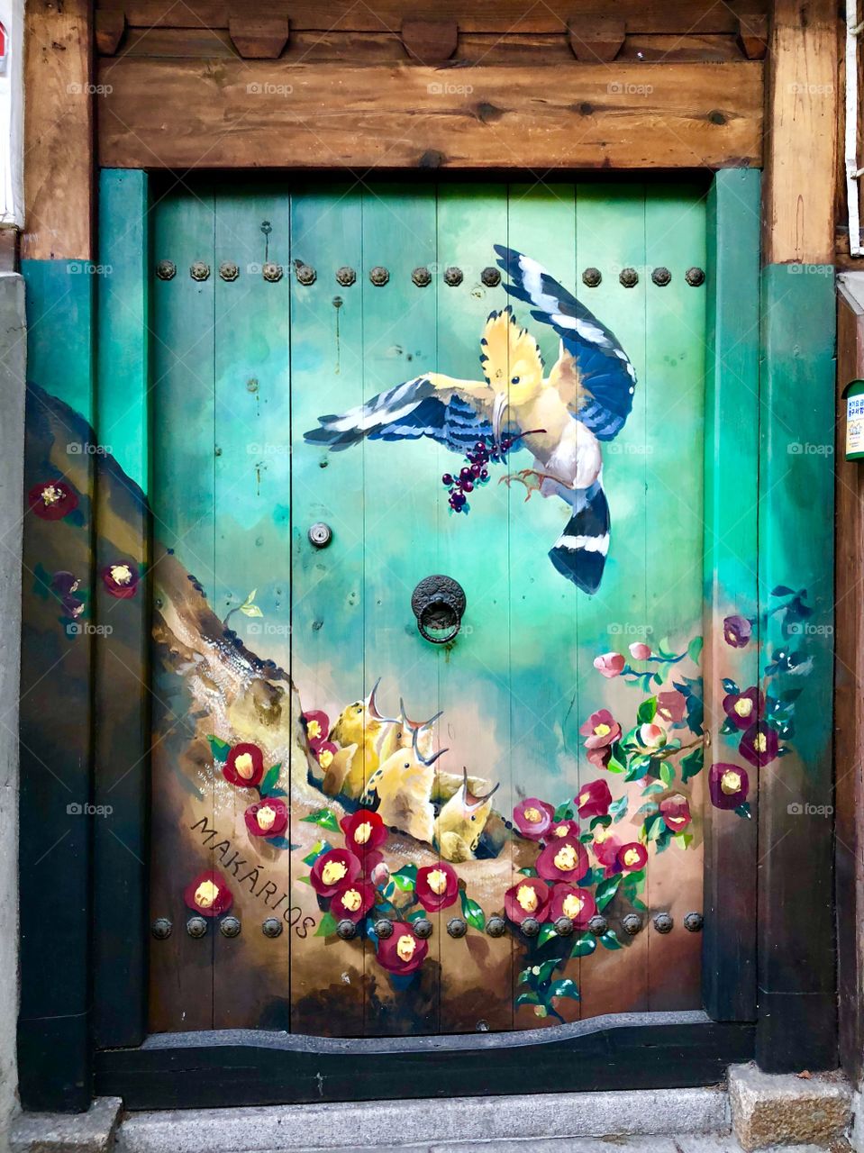 The decorative doorways of the back alley. A perfect spring time scene featuring a birds and wildflowers. 