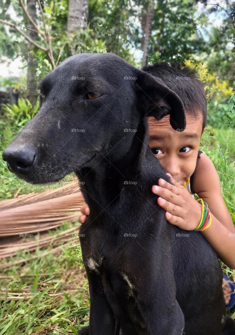 Little boy and his dog named ski 