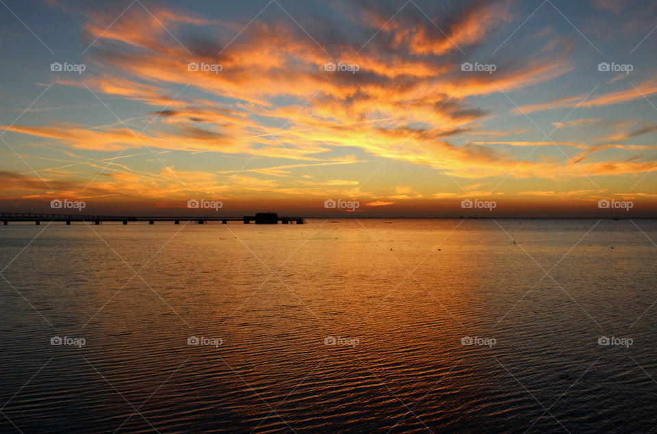 Scenic view of a  sea against dramatic sky