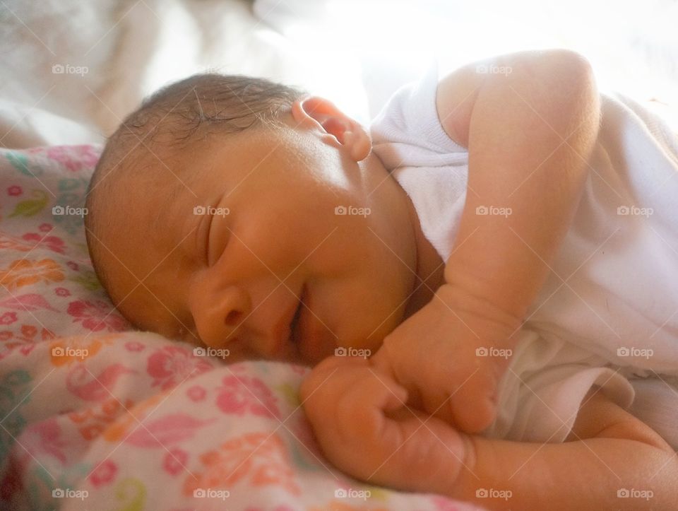 Newborn baby smile while sleeping