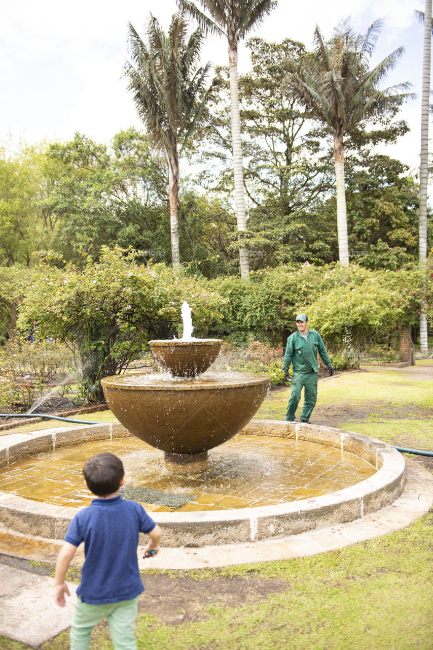 Playing in fountain 