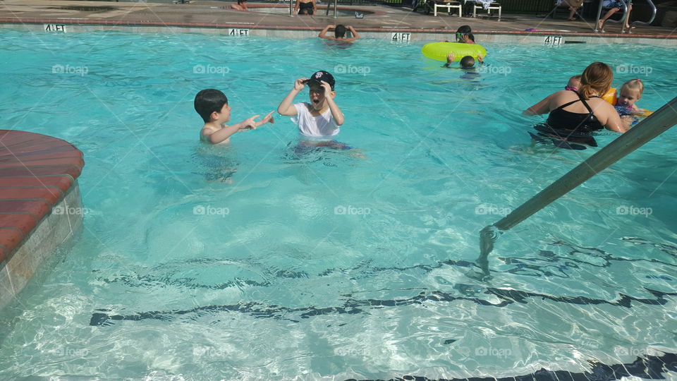 People enjoying in swimming pool
