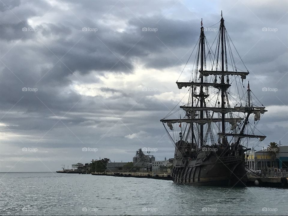 A mythical galleon under mysterious clouds.