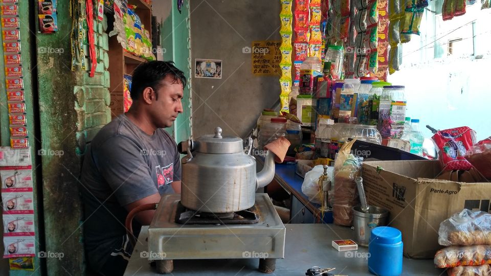 Shopkeeper selling variety of products